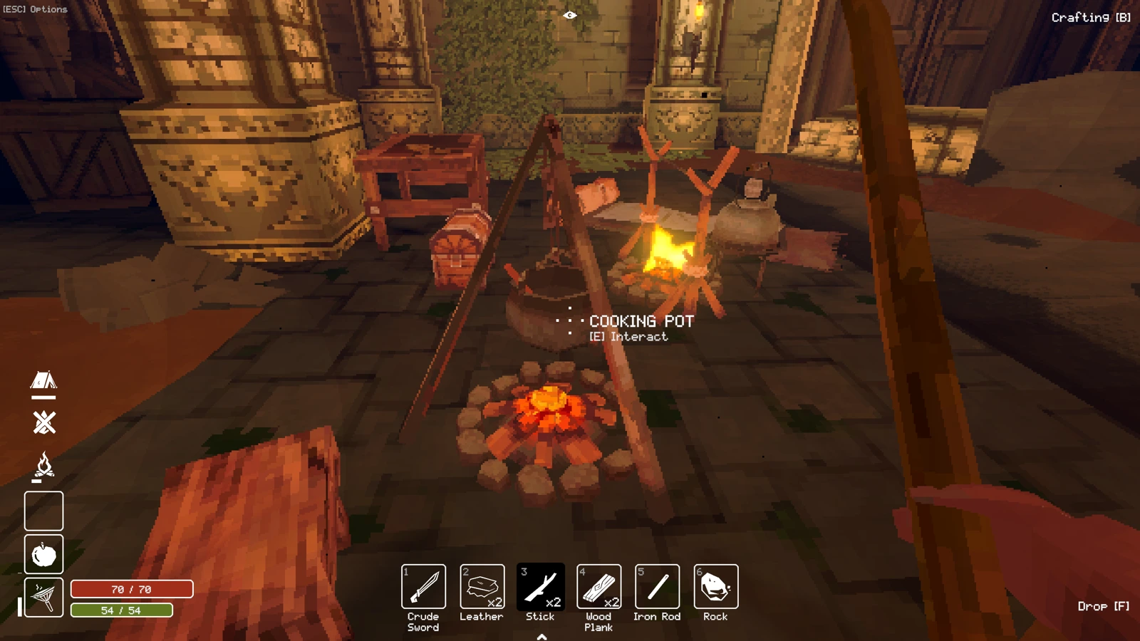 Deep Dish Dungeonで焚き火の上に置かれた調理鍋と拠点