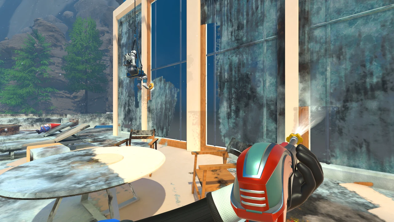 PowerWash Simulator 2で友達と建物の汚れを洗い流す場面