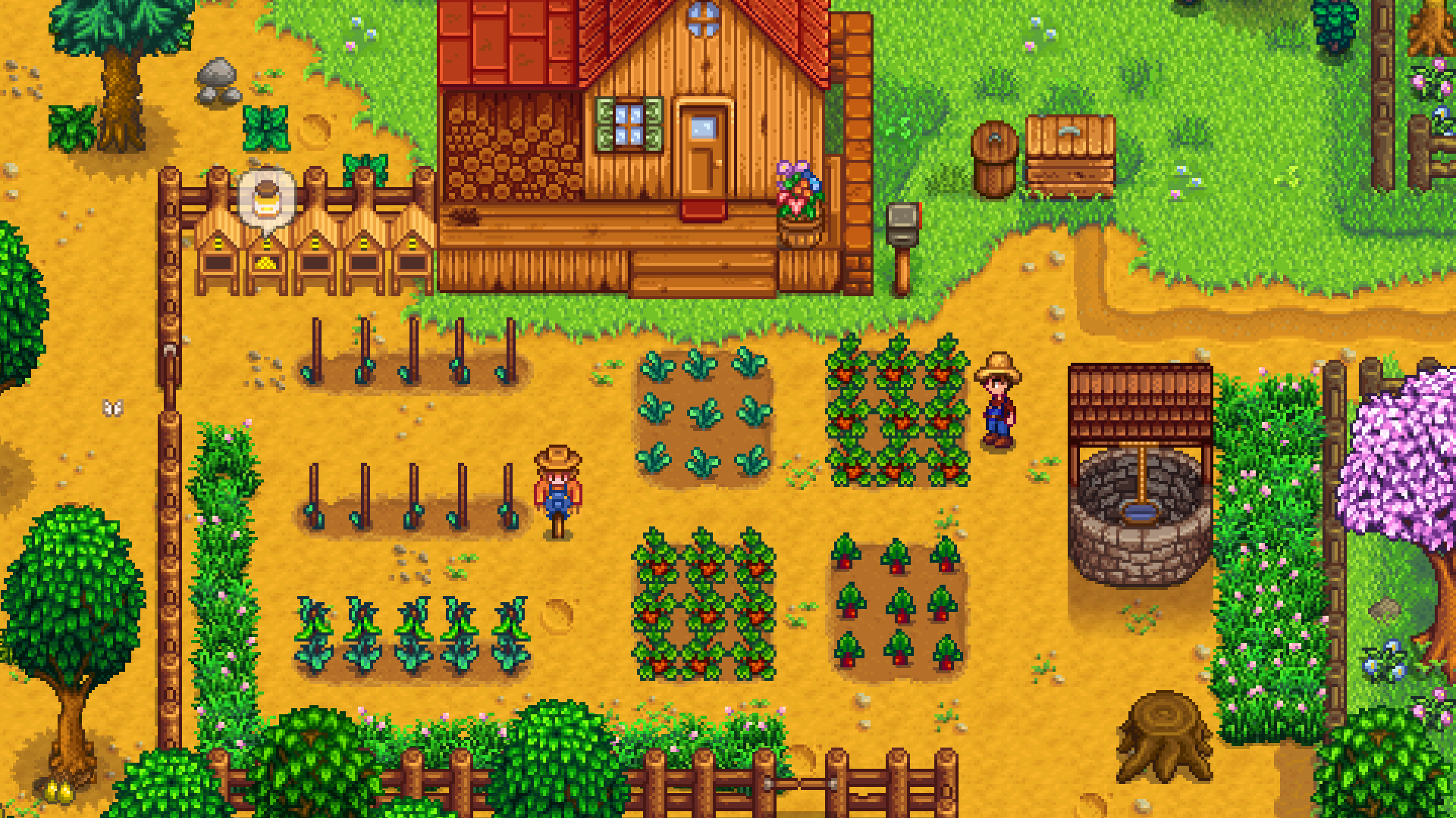 作物、かかし、ハチの巣箱が並ぶStardew Valleyの農場風景
