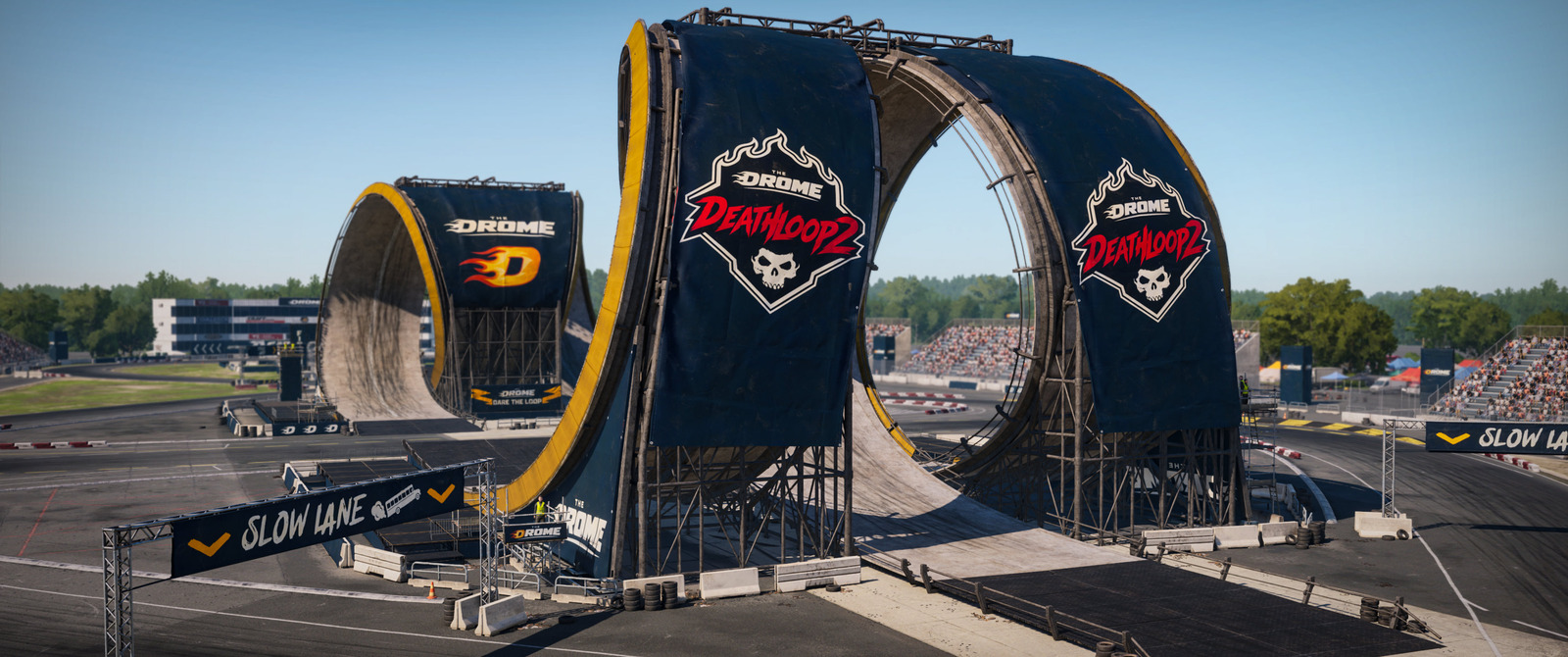 Wreckfest 2のThe Drome – Deathloop 2。観客席のあるサーキットに並ぶ巨大なループ構造。